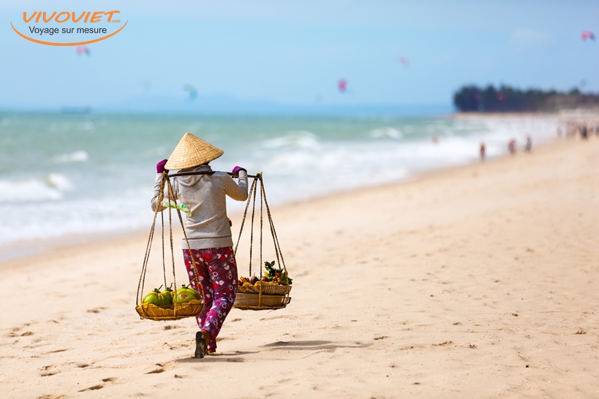 Vietnamese woman selling Fruits at Mui Ne beach. Vietnam
